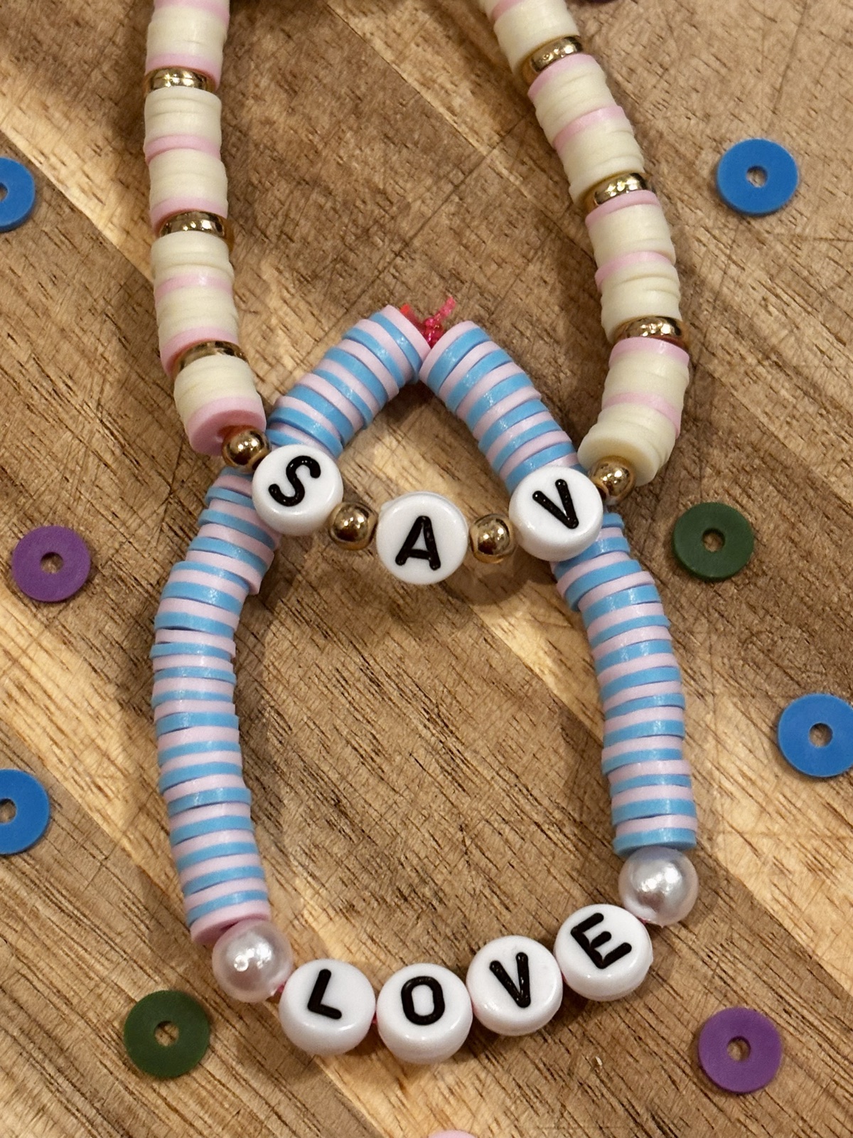 Close-up of blue and white S.A.V bracelet